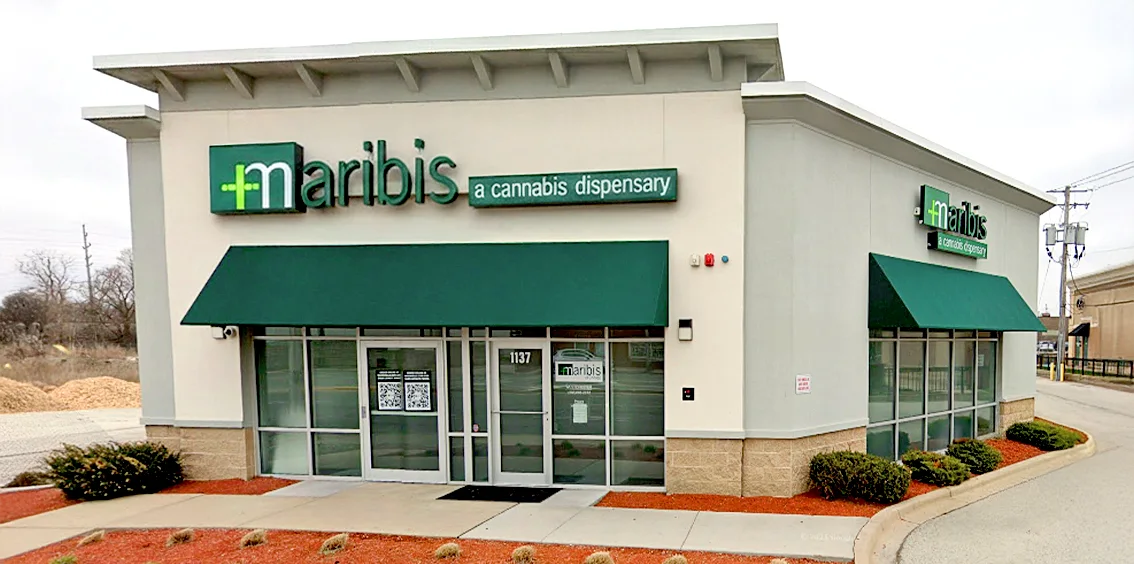 Exterior of Maribis of Westchester cannabis dispensary at 1137 S Mannheim Road in Westchester, Illinois, featuring the storefront with green awnings, glass entrance, and Maribis signage.